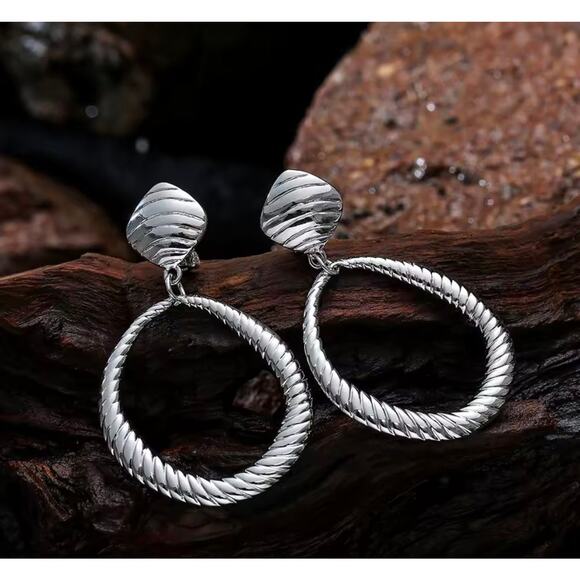 Clip on 2 3/4" large silver indented odd shaped hoop earrings - Picture 3 of 4